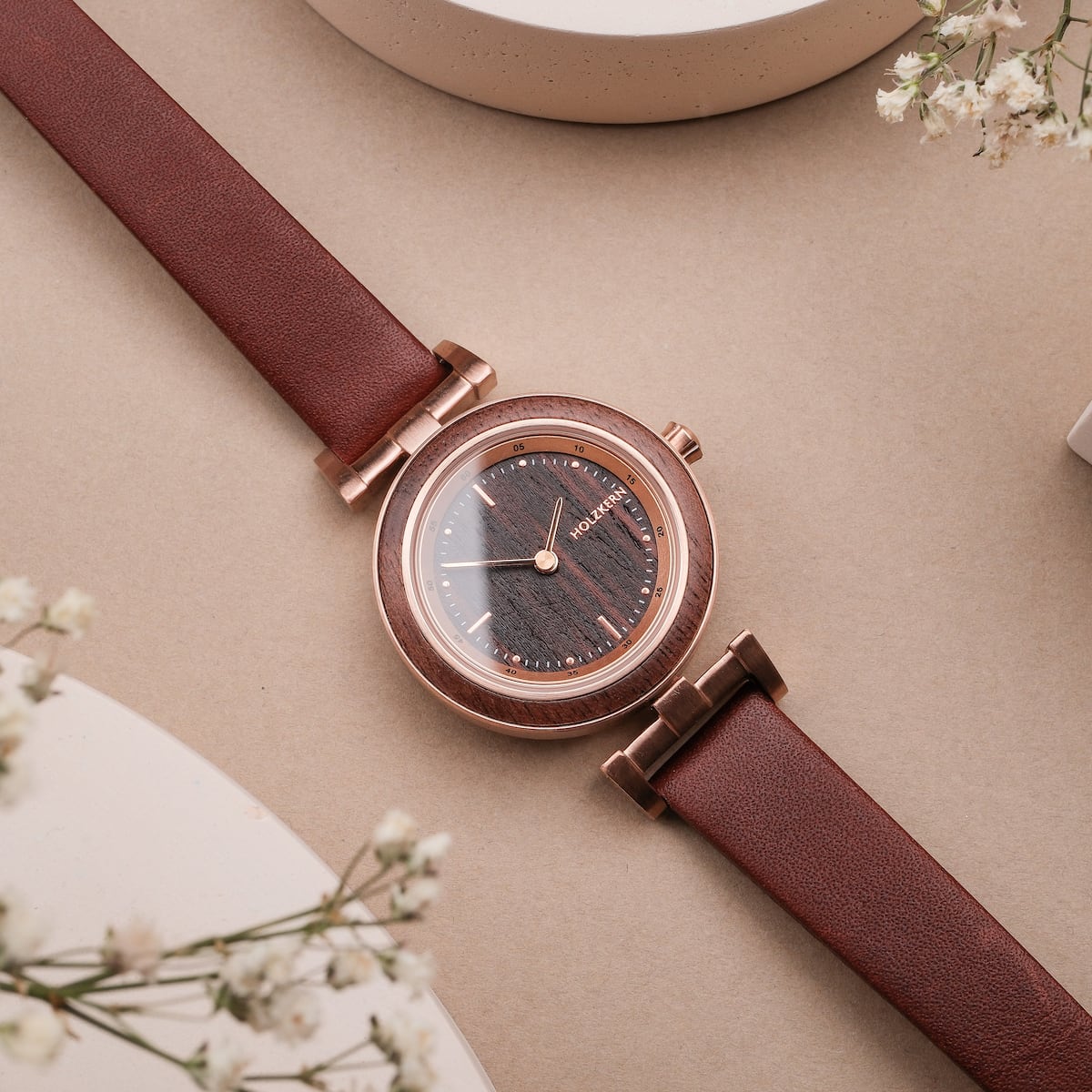 "Harriet", a stylish wristwatch featuring a walnut and maple design with a sleek, elegant look.