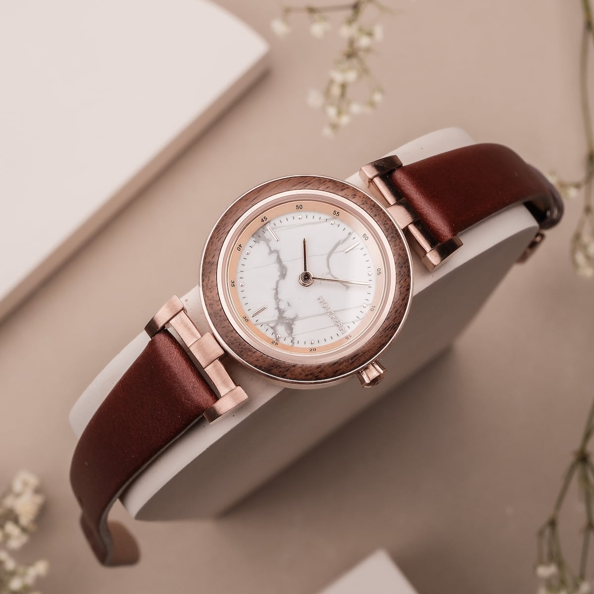 "Ida" watch, featuring walnut and marble accents with a sleek, elegant style.