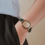 "Laura" watch with a natural wooden face and elegant, minimalist style.