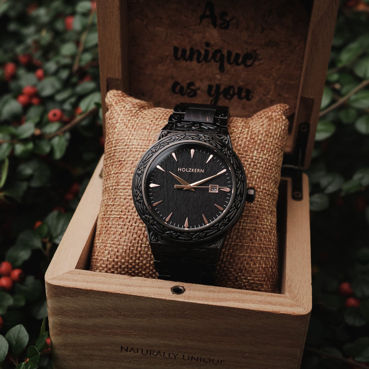 "Khalili" watch featuring a maple design with intricate carvings, presented in a rustic wooden box.