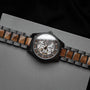 "Tenoumer" watch featuring a Koa and dark grey design with a distinctive skeletal dial.