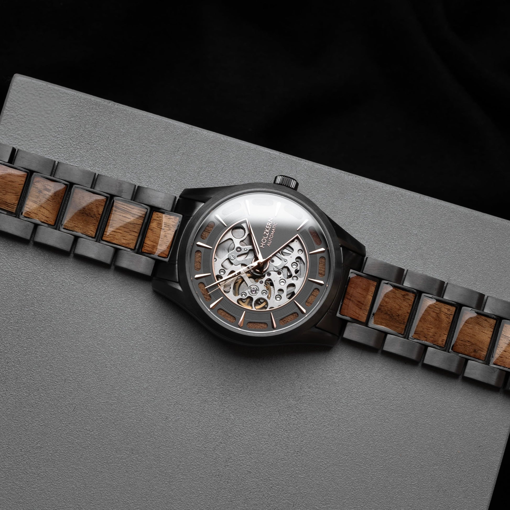 "Tenoumer" watch featuring a Koa and dark grey design with a distinctive skeletal dial.