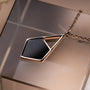 "Mandala Necklace, a geometric necklace, featuring a modern marble and rose gold design."