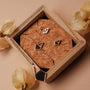 "Mandala Necklace necklace, featuring a geometric marble design with rose gold elements, elegantly displayed in a wooden box."